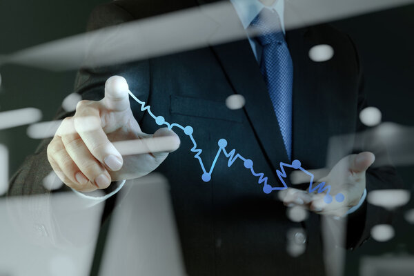 Двойная экспозиция руки бизнесмена, работающего с новой современной компанией
