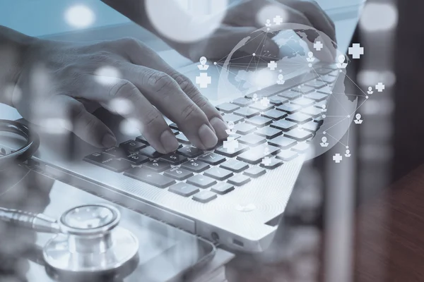 Doctor working with digital tablet and laptop computer in medica — Stock Photo, Image