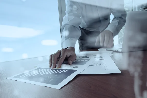 double exposure of businessman hand working with business docume