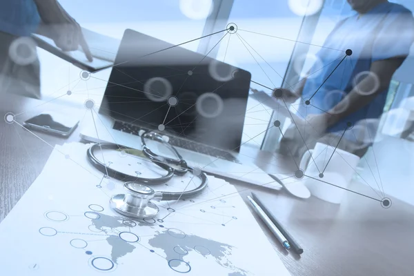 Team doctor working with laptop computer in medical workspace of — Stock Photo, Image