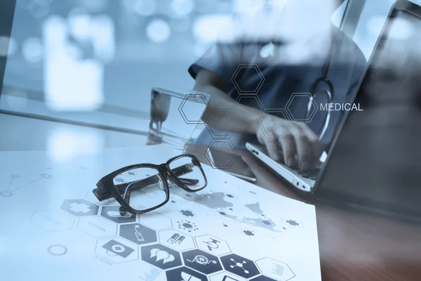 Doctor working with digital tablet and laptop computer in medica — Stock Photo, Image