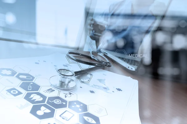 Doctor working with digital tablet and laptop computer in medica — Stock Photo, Image