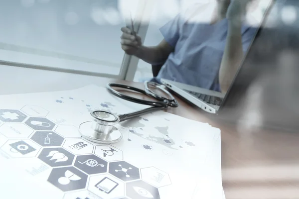 Doctor working with digital tablet and laptop computer in medica — Stock Photo, Image