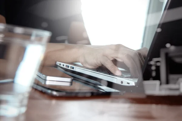 Double exposure of business man hand working on laptop computer — Stock Photo, Image