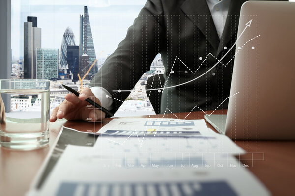 business documents on office table with smart phone and digital 