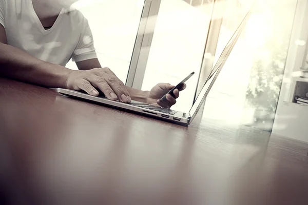 Business man hand working on laptop computer on wooden desk as c — Stock Photo, Image