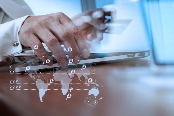 Close up of hands using laptop and holding credit card with soci — Stock Fotó