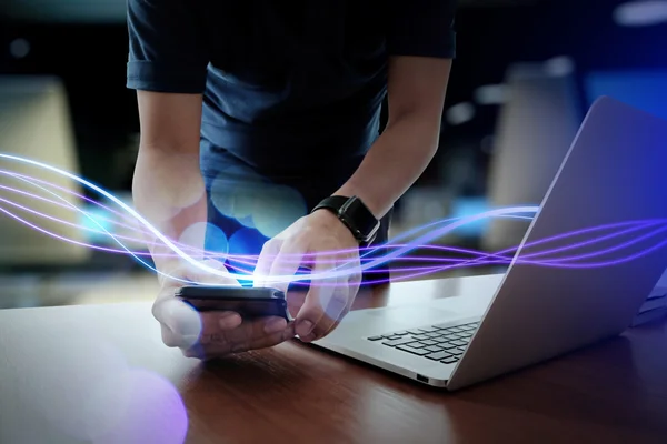 Waves of blue light and businessman using on smartphone as conce — Stock Photo, Image