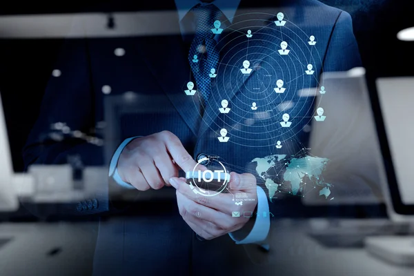 Double exposure of hand showing Internet of things (IoT) word di — Stock Photo, Image