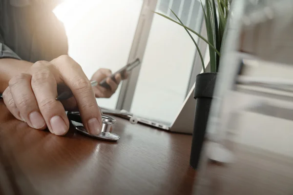 Doctor working with laptop computer in medical workspace office — Stock Photo, Image