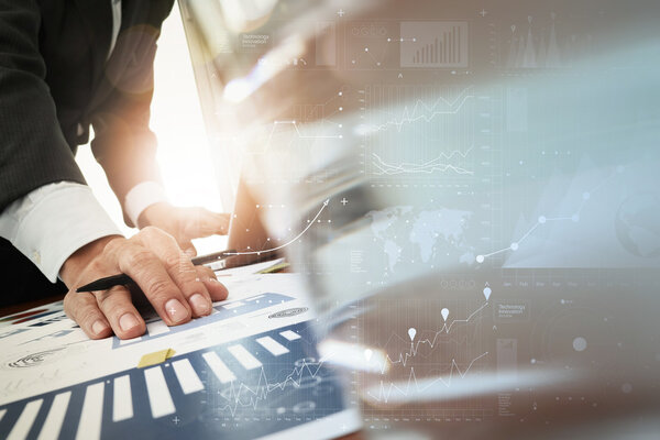 business documents on office table with smart phone and laptop c