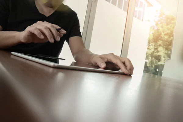 Businessman working with digital tablet computer on wooden desk — Stock Photo, Image