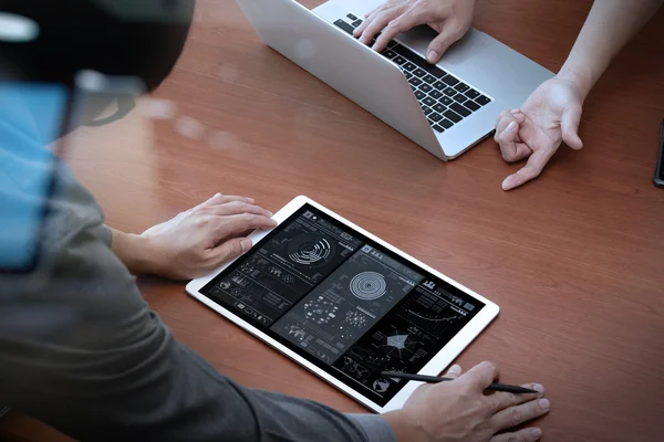 Top view of two colleagues discussing data with new modern compu — Stock Photo, Image