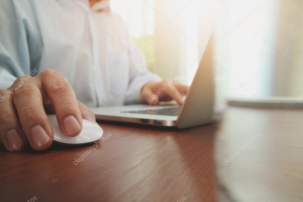 close up of business man hand working on laptop computer with so