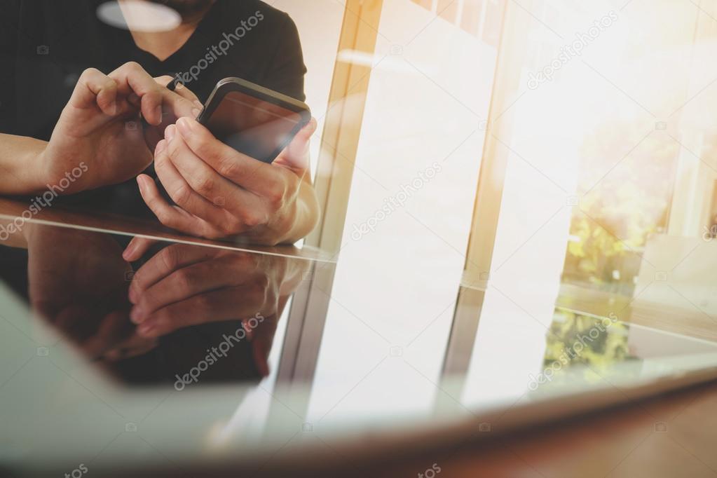 businessman hand working with new tablet modern computer and sma