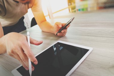 top view of Designer hand working with digital tablet computer o