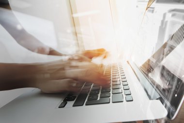designer moving hands working with laptop computer and digital w