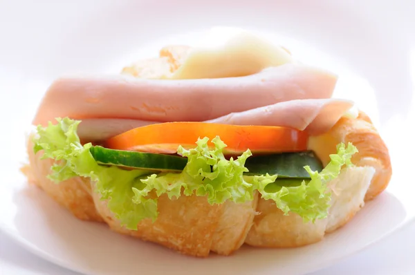 Croissant with ham and cheese — Stock Photo, Image