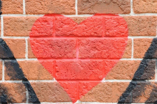 Red heart on brick wall — Stock Photo, Image