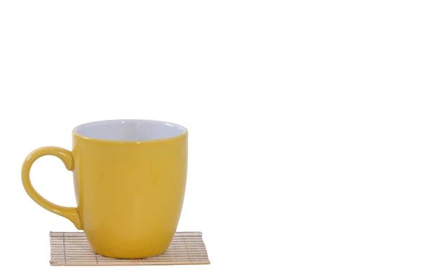 Coffee cup on mat — Stock Photo, Image