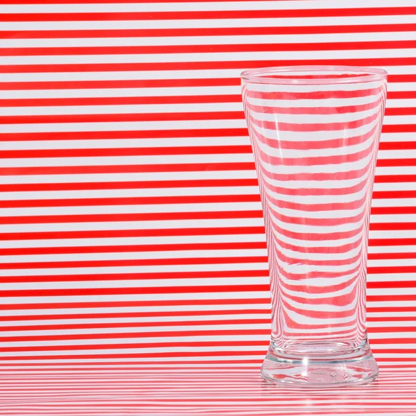 Water in glass with red lining — Stock Photo, Image