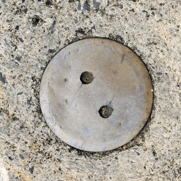 Manhole cover on street — Stock Photo, Image