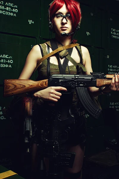 Weapon girl  in a storage — Stock Photo, Image