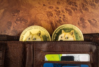 Dogecoins in a wallet on a table clipart