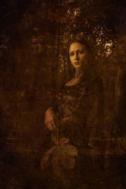 Güz yapraklı güzel esmer kadın parkta yürüyor.