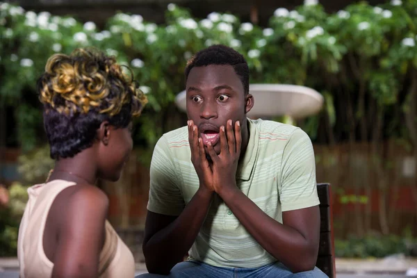 Young Man Tee Shirt Sitting Outdoors Looking His Girlfriend Surprised — Stock Photo, Image