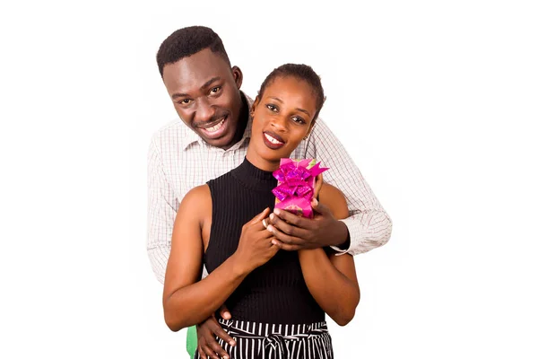 Young Couple Standing White Background Package Watching Camera Smiling — Stock Photo, Image