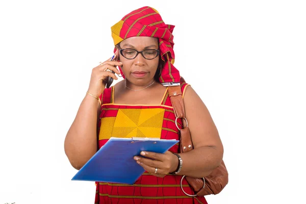 Mature Businesswoman Standing White Background Communicating Cellphone Looking Notebook — Stock Photo, Image