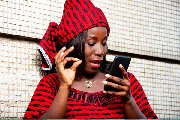 Mature Woman Loincloth Standing Wall Looking Mobile Phone Smiling — Stock Photo, Image