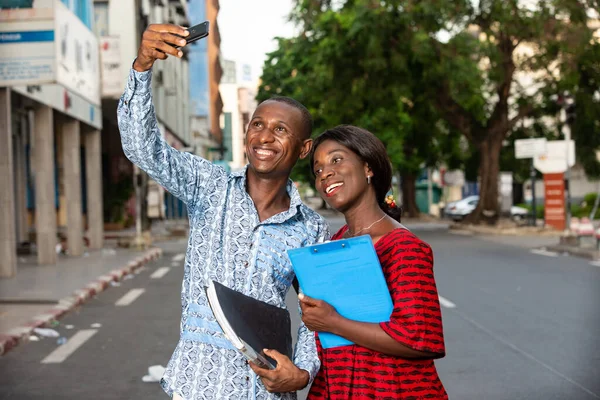 African Business People Smile While Looking Funny Photo Watching Video — Stock Photo, Image