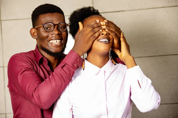 Portrait Young Man Smiling Covering Eyes His Girlfriend Surprise — Stock Photo, Image
