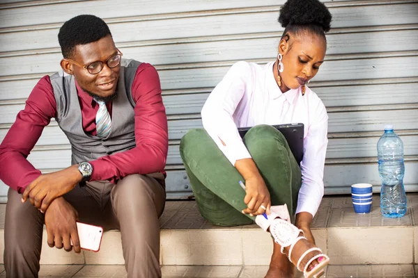 Two Young African People Sitting Man Look Woman Wearing Her — Stock Photo, Image