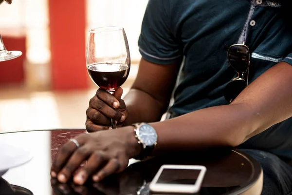 Young Man Sitting Bar Holding Glass Red Wine His Arm — Stock Photo, Image