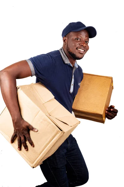 Bonito Jovem Entregador Homem Azul Uniforme Tampa Segurando Dois Papelão — Fotografia de Stock