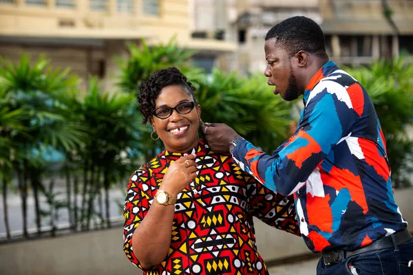 Handsome Young Man Putting Earrings Woman Wearing Eyeglasses Outdoors Street — Stock Photo, Image