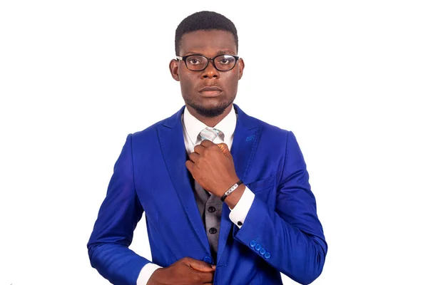 Serious Young Businessman Wearing Blue Jacket Eyeglasses Straightening His Tie — Stock Photo, Image