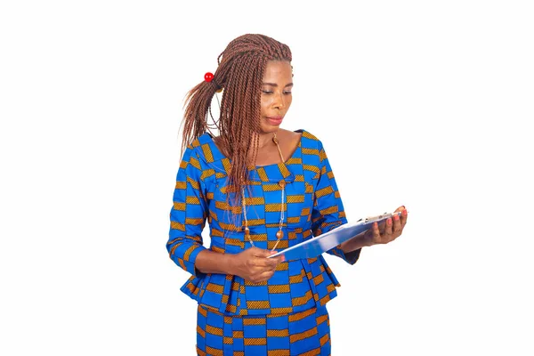 Beautiful African Businesswoman Traditional Dress Standing White Background Looking Notepad — Stock Photo, Image