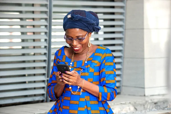 Beautiful Adult Businesswoman Standing Using Mobile Phone While Smiling — Stock Photo, Image