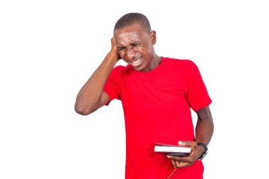 adult businessman having headache, keeping hand on head, holding notebook.