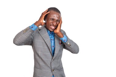 handsome adult businessman keeping hands on head, suffering from headache.