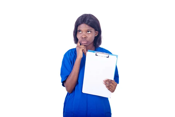 Young Charming Nurse Lab Coat Standing White Background Stethoscope Thinking — Stock Photo, Image