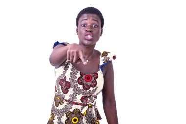 portrait of a beautiful young woman in a traditional loincloth, explains something and points the finger at you.