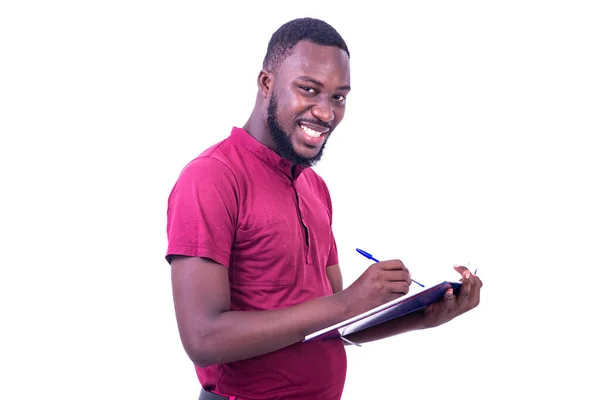 Retrato Joven Feliz Guapo Usando Camiseta Roja Escribiendo Cuaderno Con —  Fotos de Stock