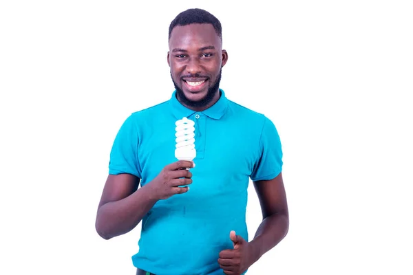 Young Businessman Blue Shirt Standing White Background Showing Light Bulb — Stock Photo, Image