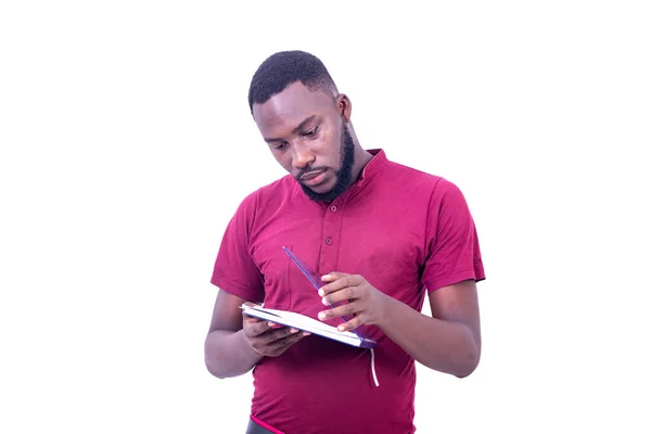 Portrait Serious Young Man Wearing Red Shirt Opening His Notebook — Stock Photo, Image