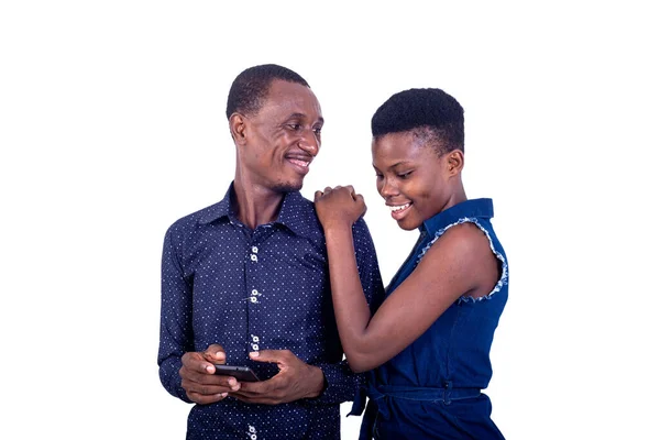 Young Couple Standing White Background Holding Cellphone Smiling — Stock Photo, Image